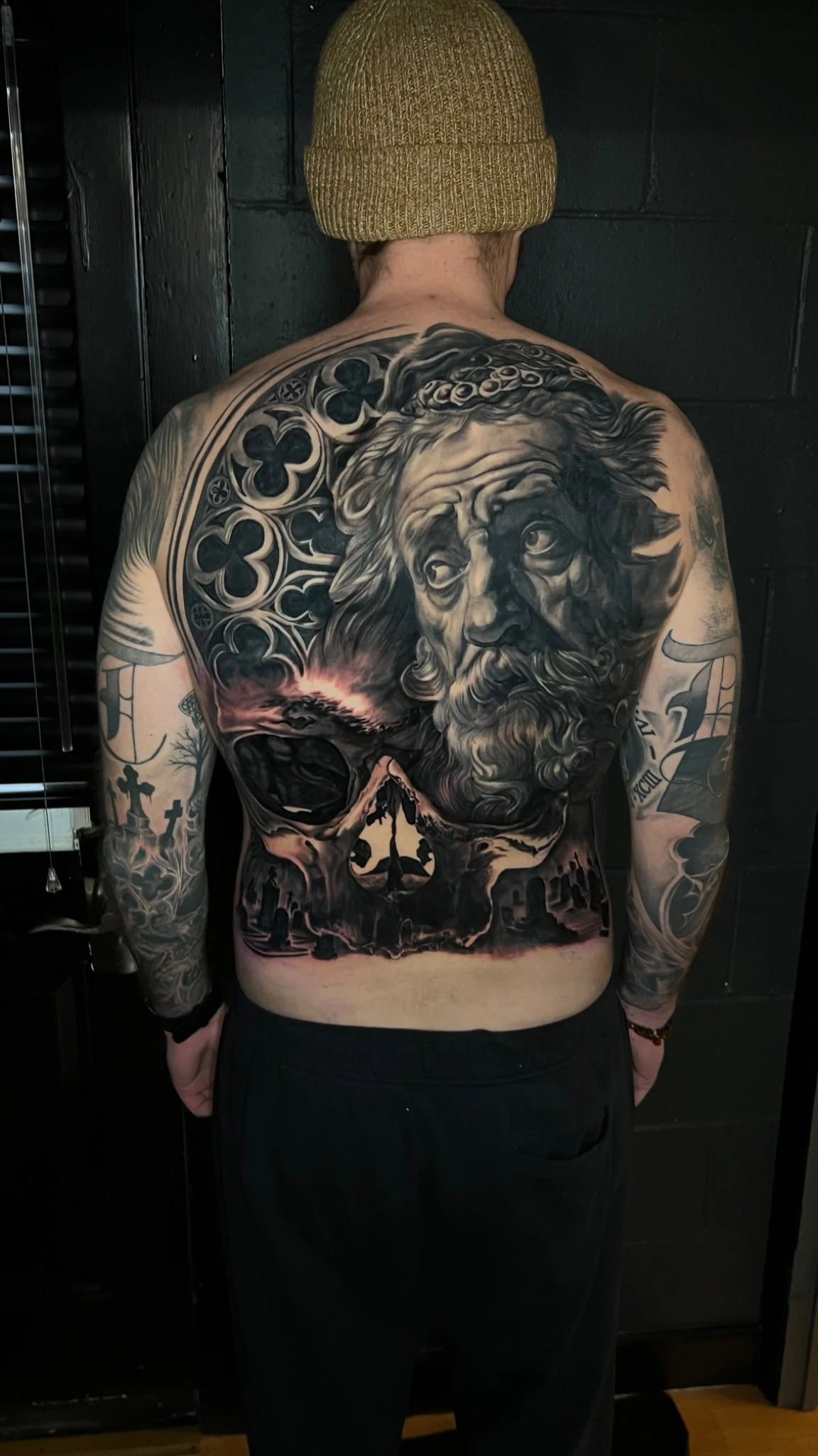 Large-scale black and grey realism back tattoo by Sean Connolly