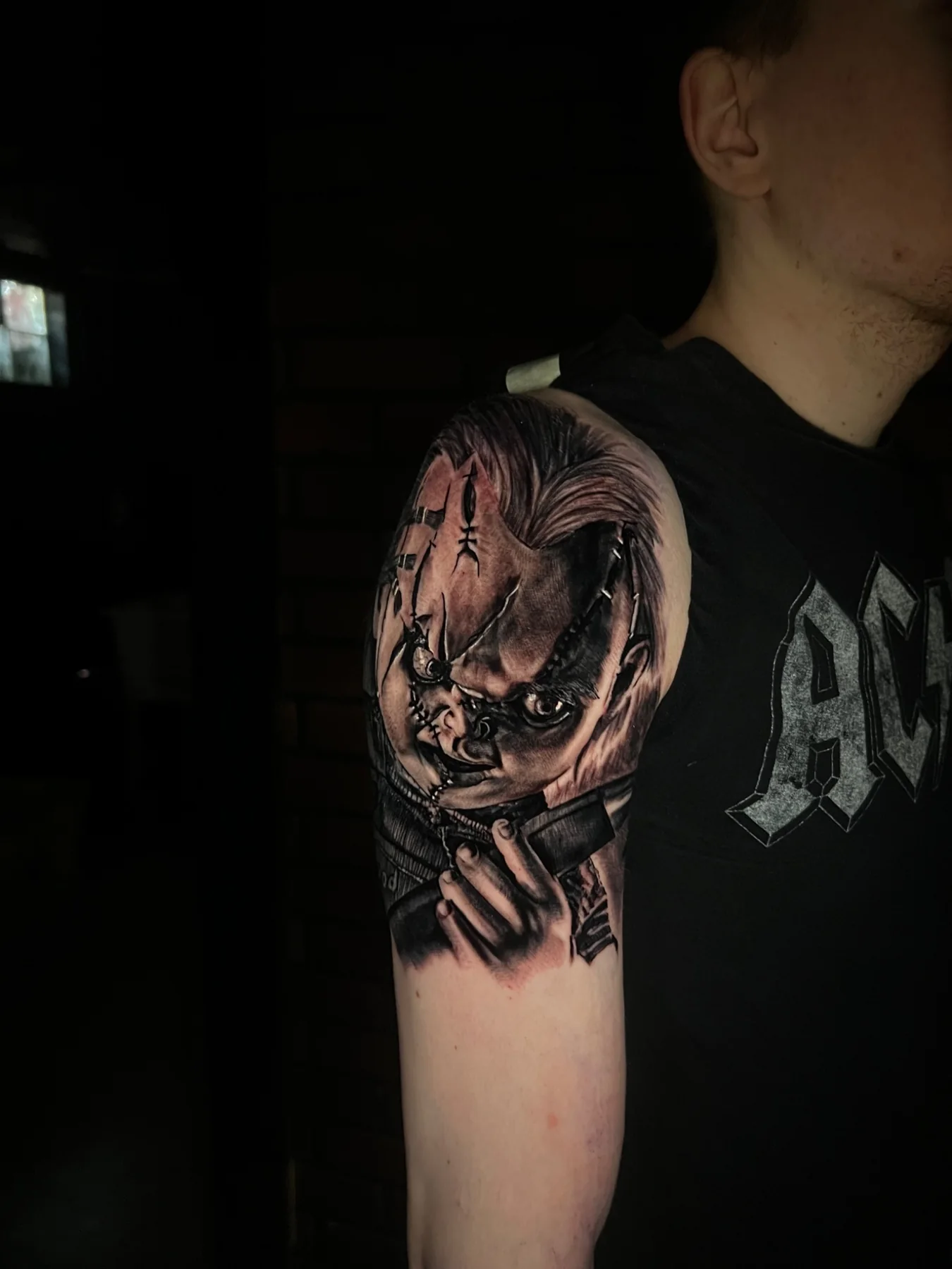 Black and grey horror character portrait tattoo