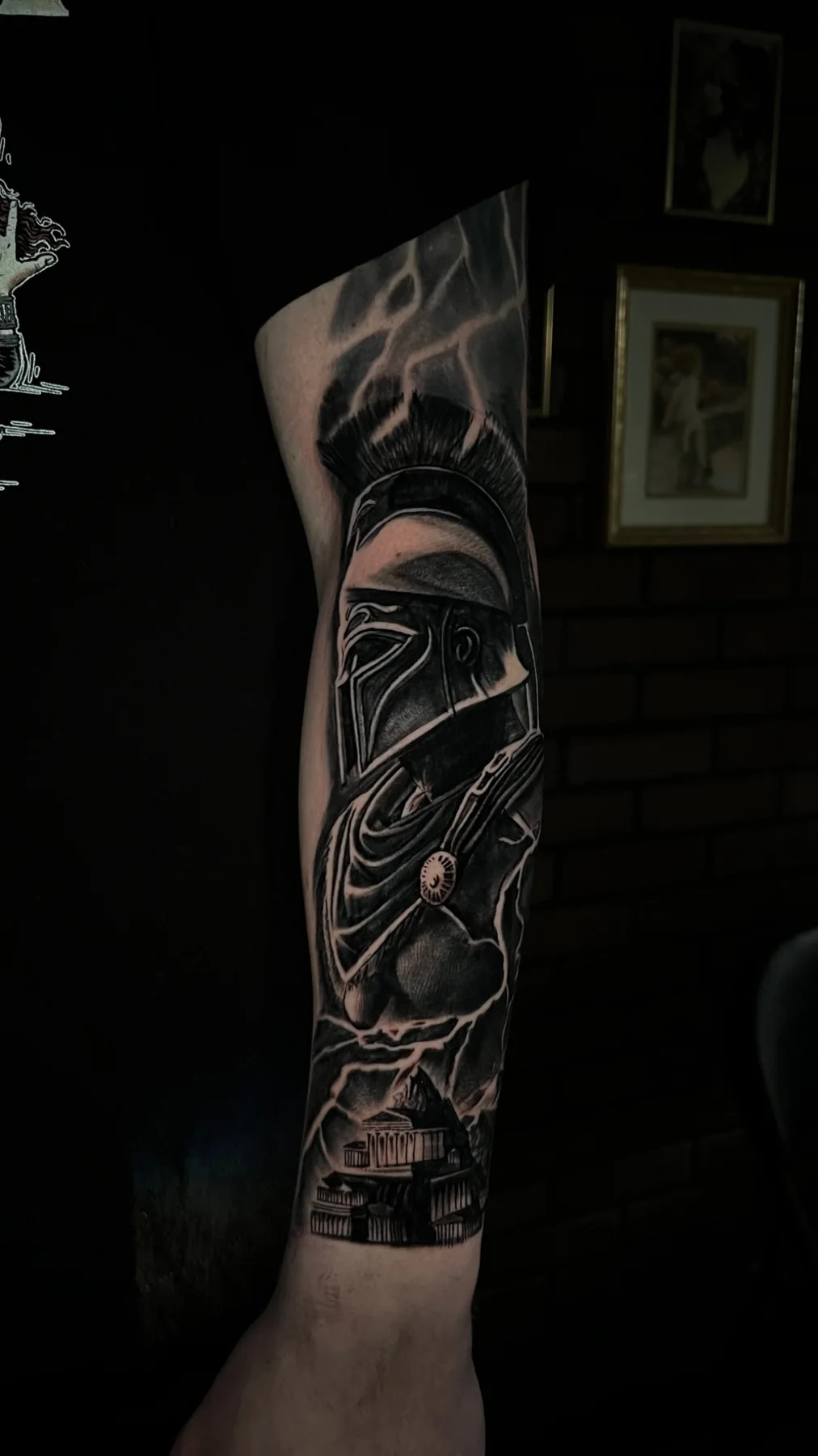Black and grey armored sci-fi character tattoo