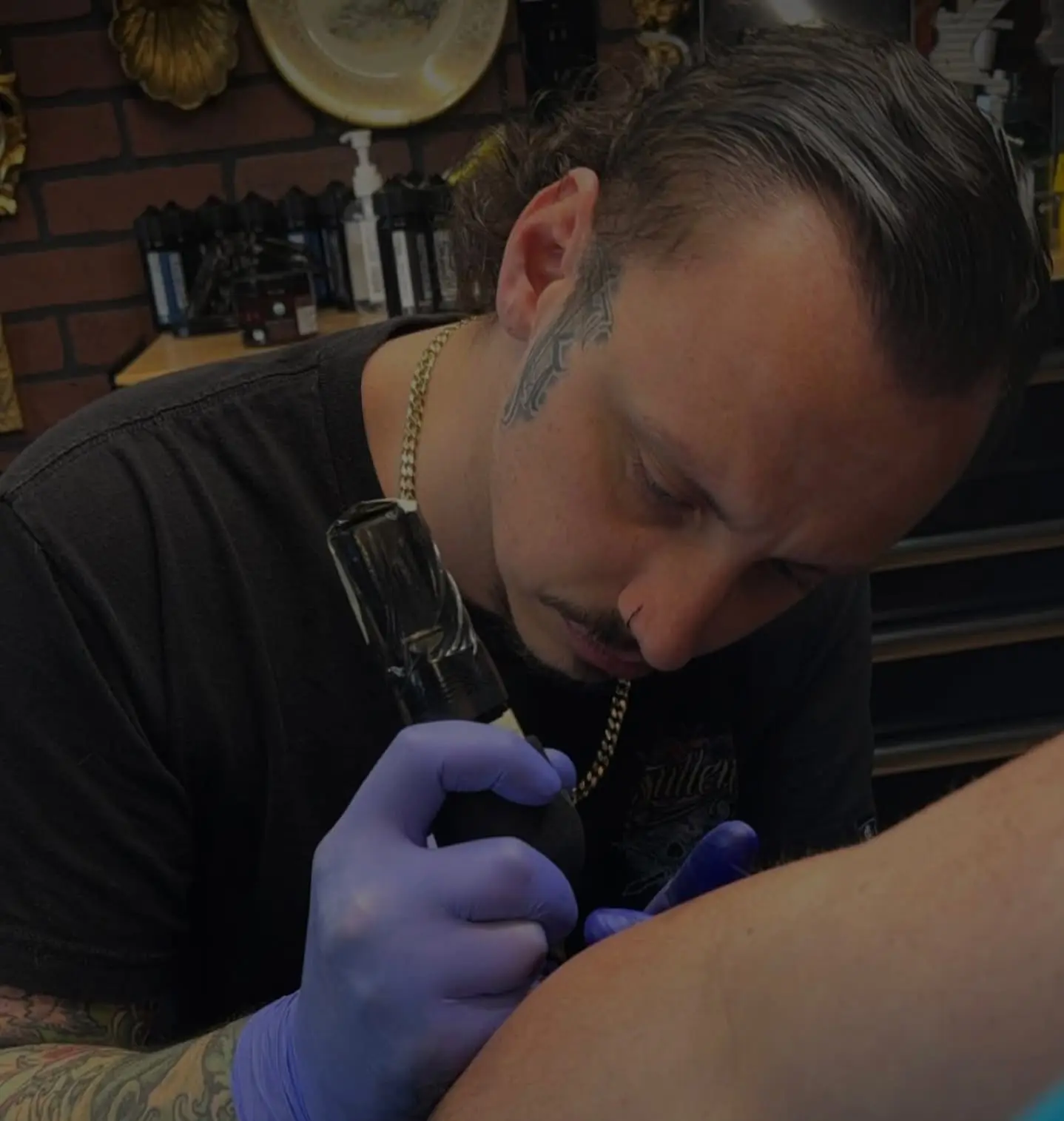 Sean Connolly tattooing a client at Rising Tide Tattoo in Canfield, Ohio